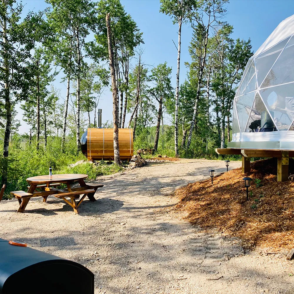 Ignis dome campsite view with outdoor dry sauna, picnic bench and bbq