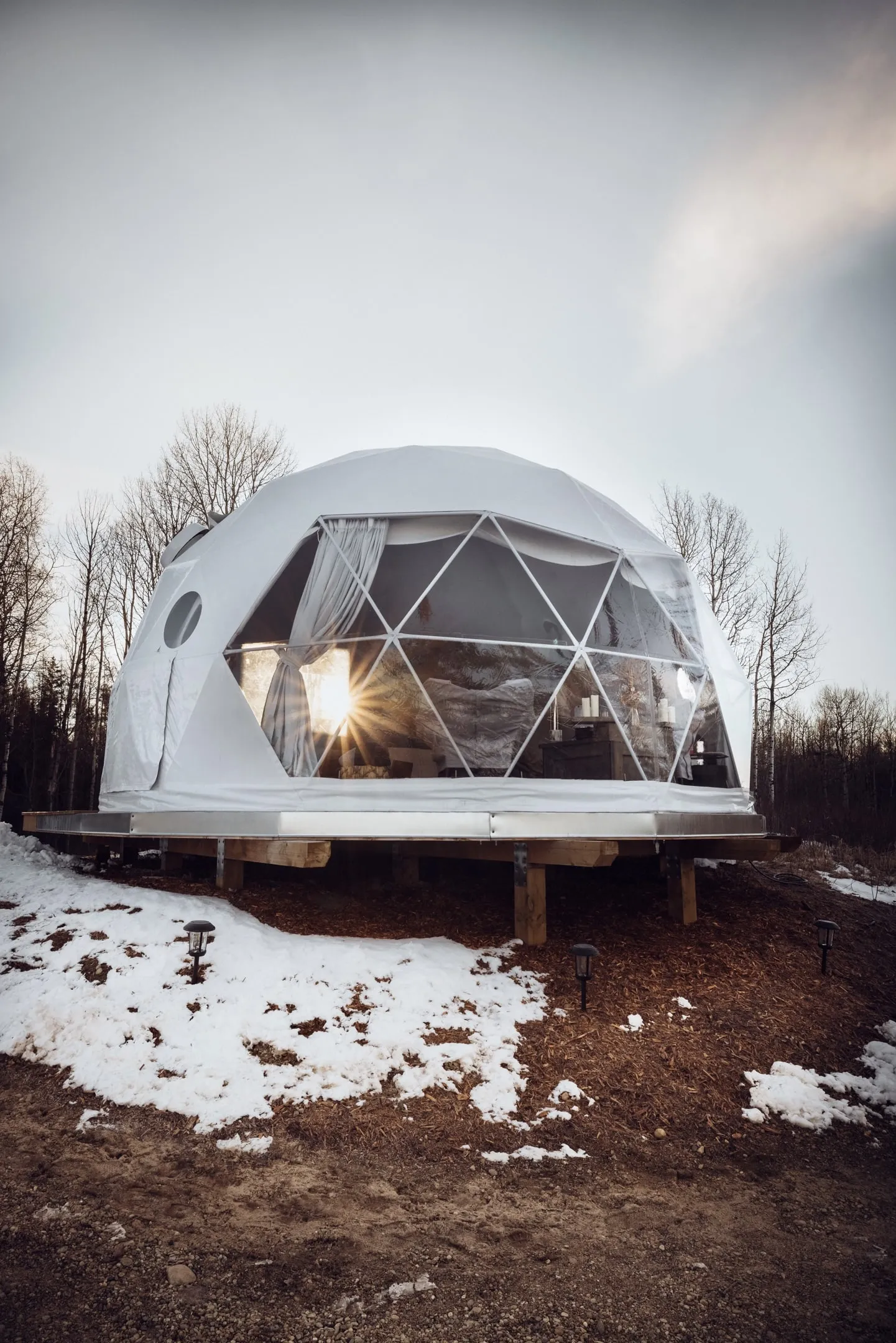 outdoor ignis dome during winter with snow just melting off the ground
