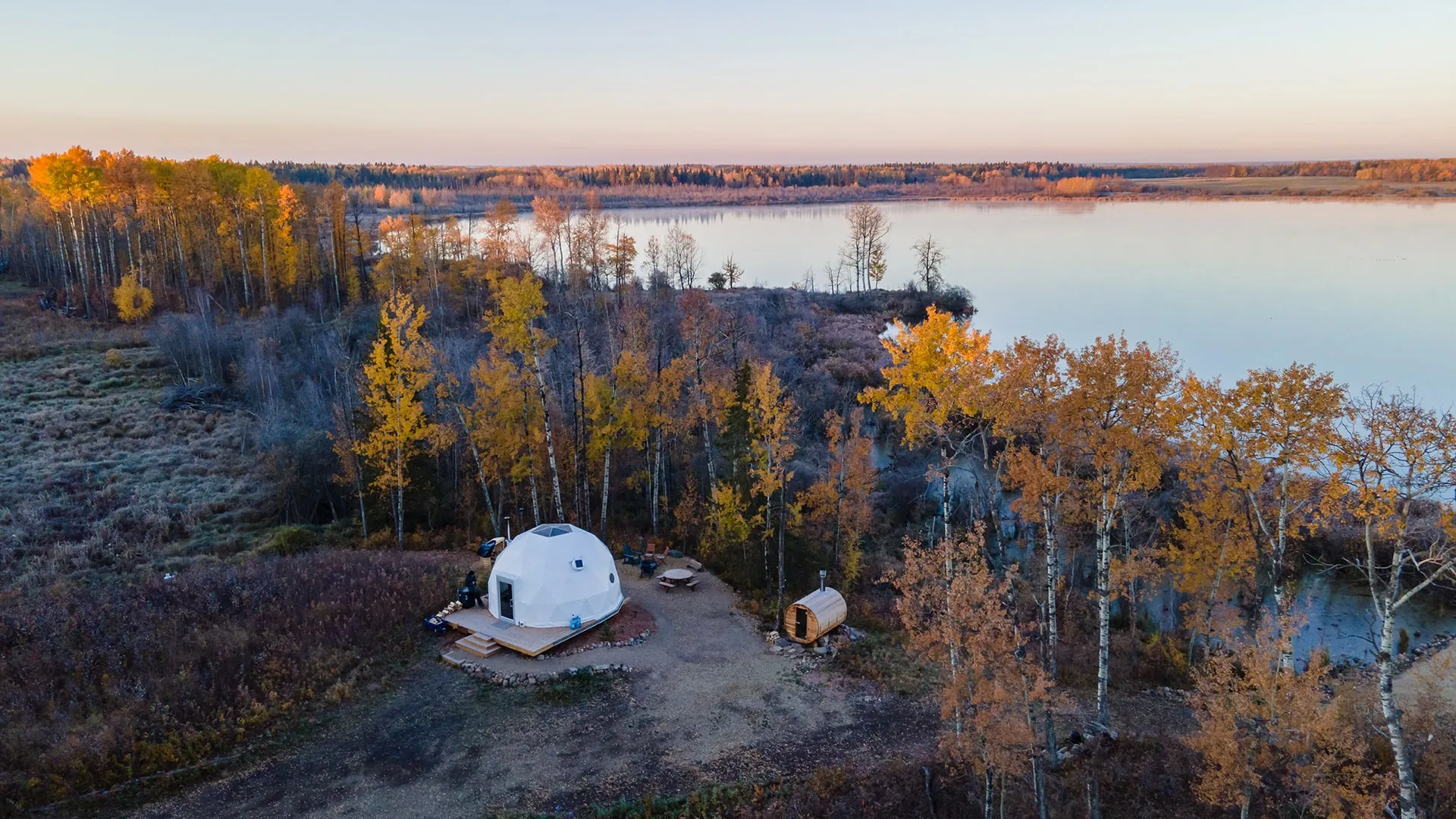 distance birds eye view of ignis dome with outdoor sauna and picnic table