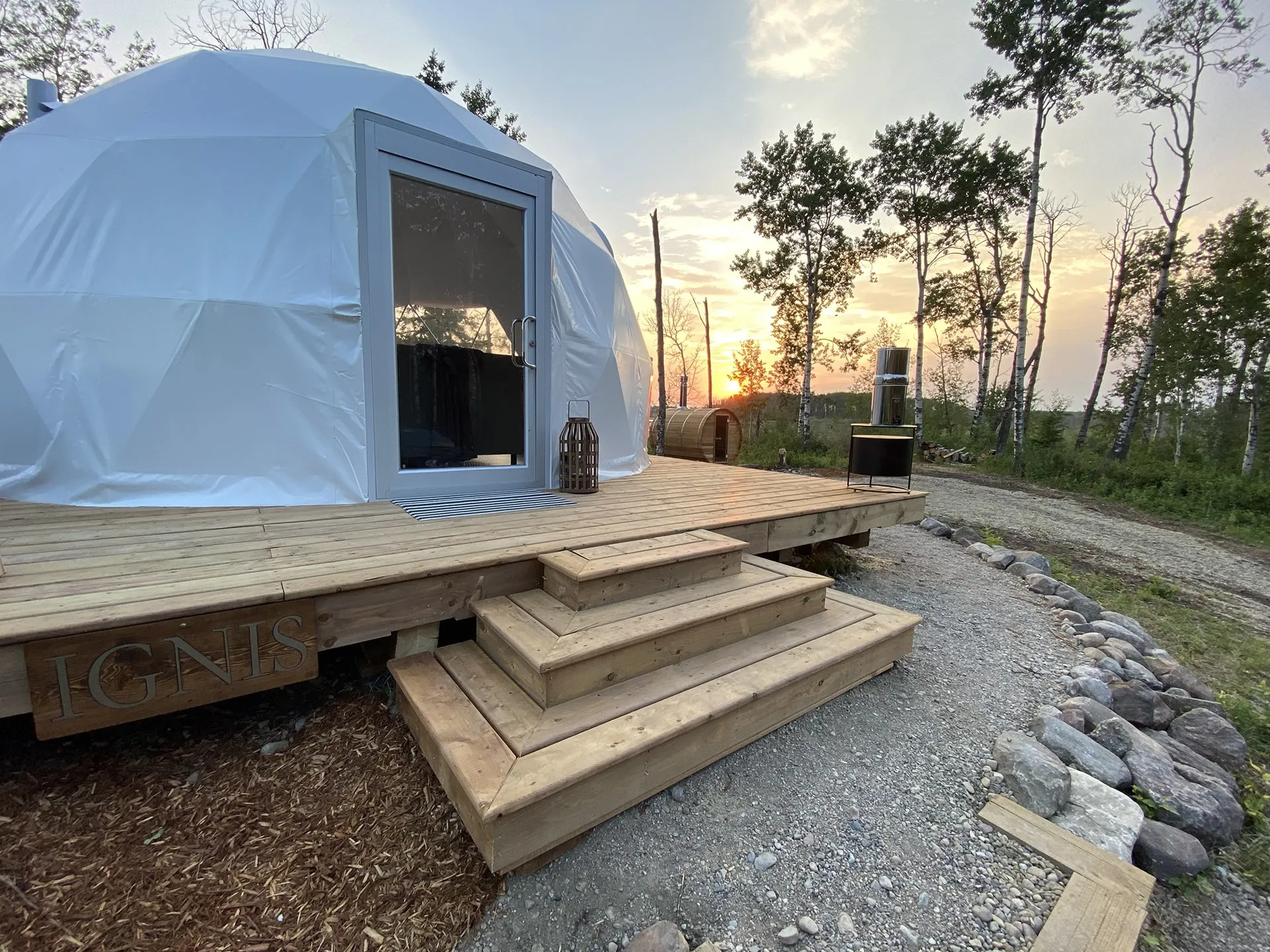 Close up front entrance of the ignis dome with front porch and outdoor dry sauna