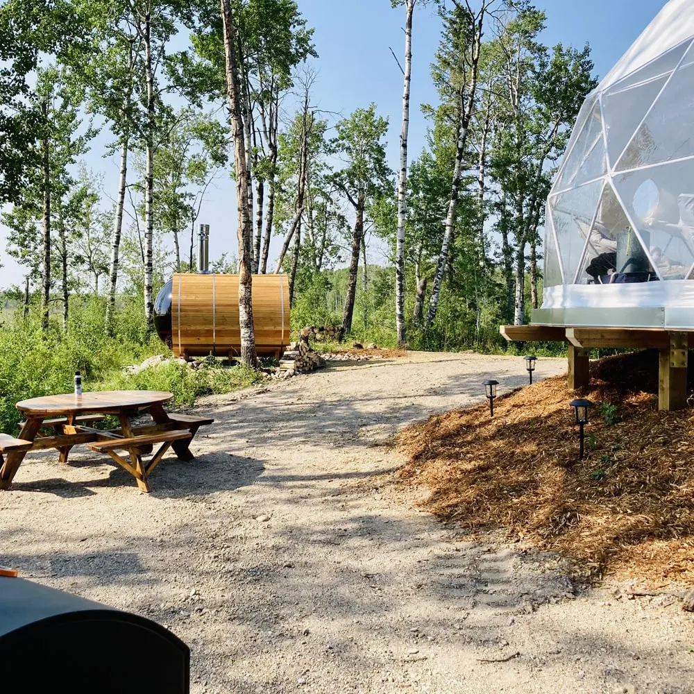 Ignis dome campsite view with outdoor dry sauna, picnic bench and bbq